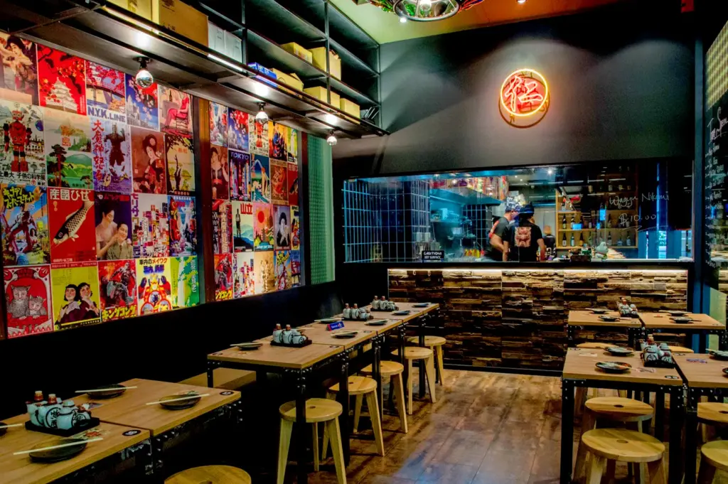 Authentic Japanese ramen shop interior in Singapore with cozy dining atmosphere and open kitchen