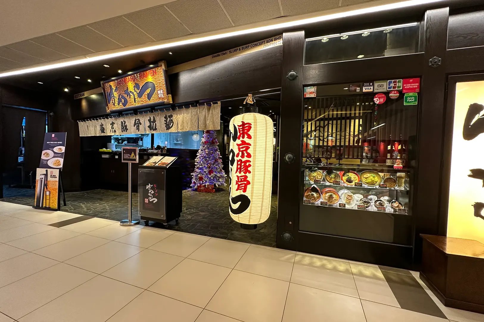 Bankara Ramen Malaysia storefront with large white lantern and menu display case.