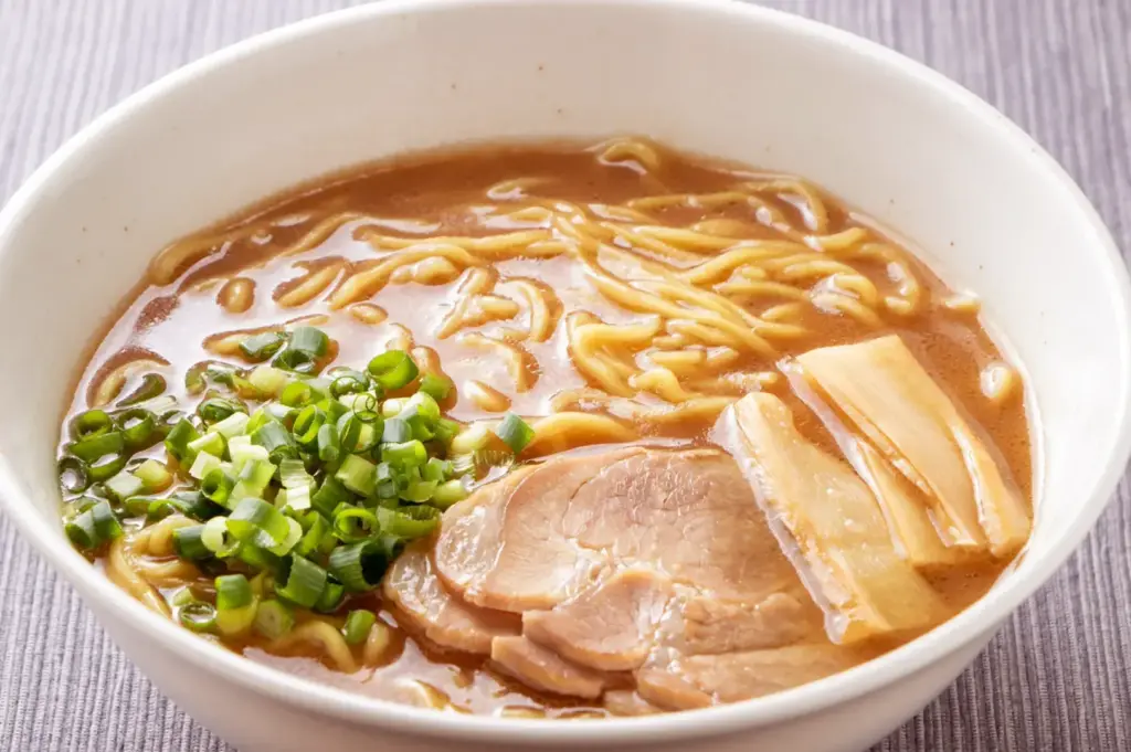 Shoyu ramen with soy-based broth, chashu pork, menma, and scallions.